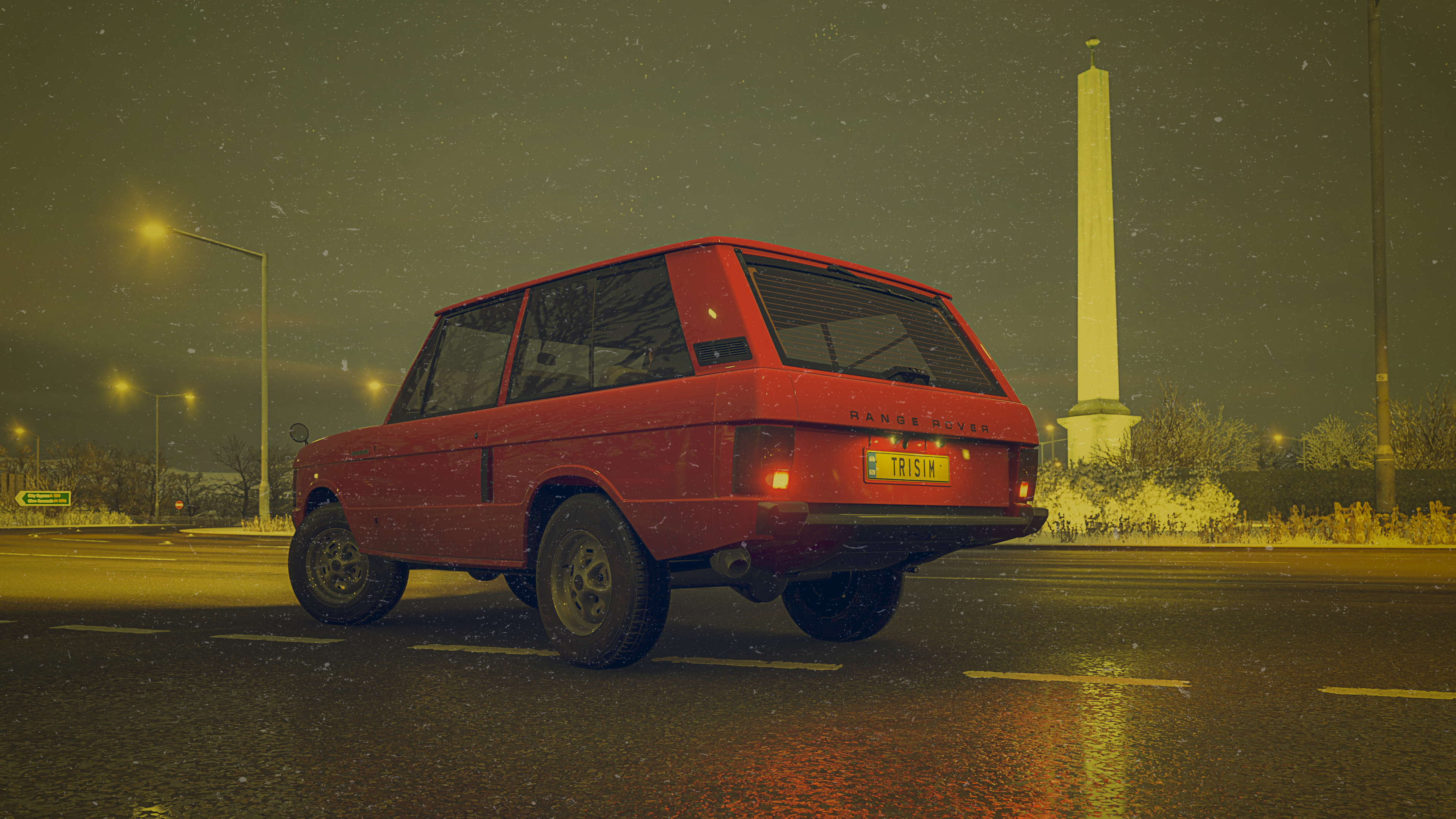 range rover 1973 pictured on a roundabout with a vintage look applied in photoshop